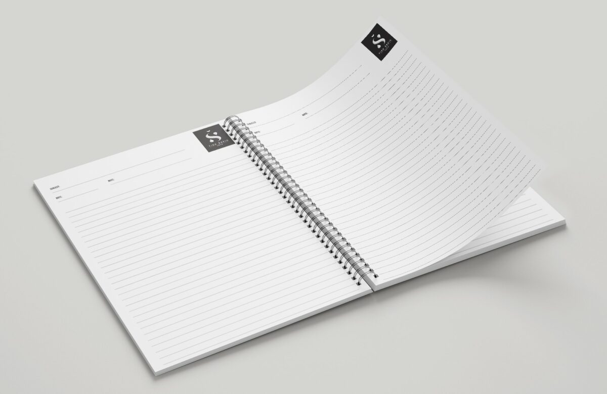 Photo shows an open printed notepad.